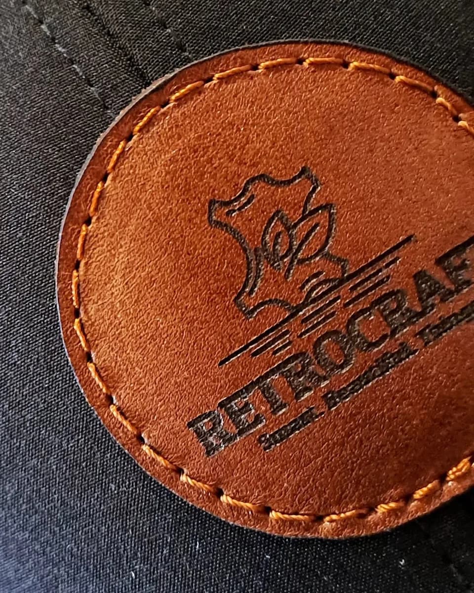 RetroCraft's own leather patch, laser-engraved and stitched in the Kempton Park workshop
