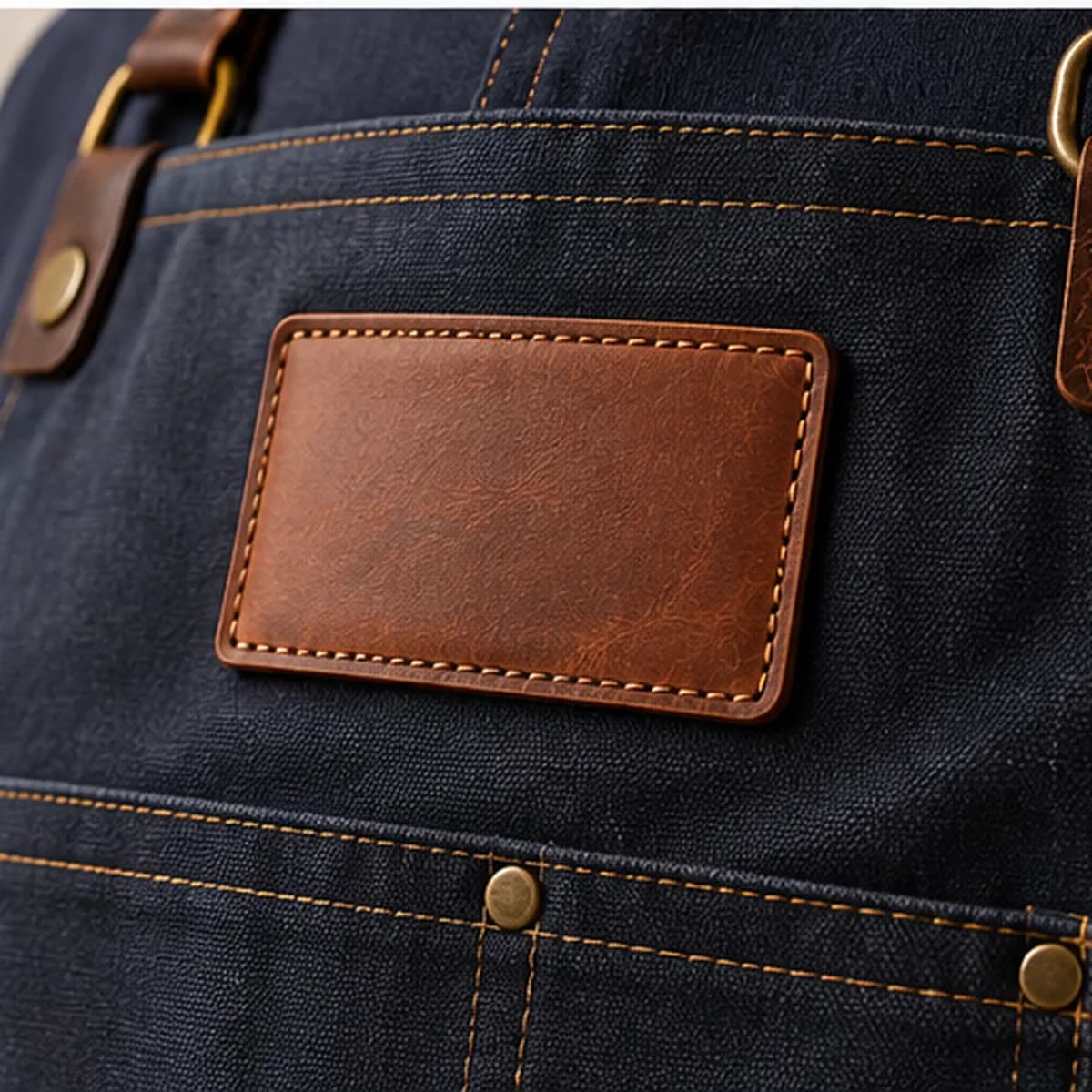 A leather patch on a denim apron