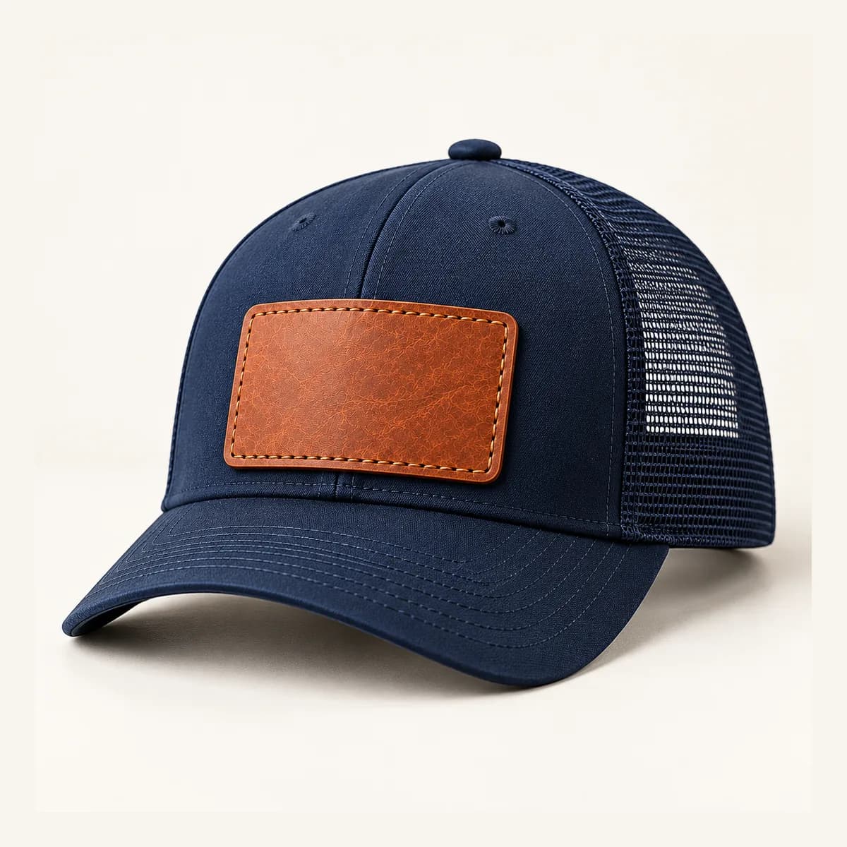 A navy trucker cap with a leather patch