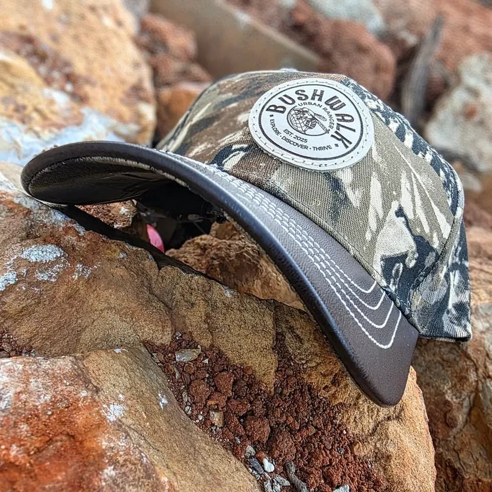 Bushwalk camo trucker cap with a leather patch