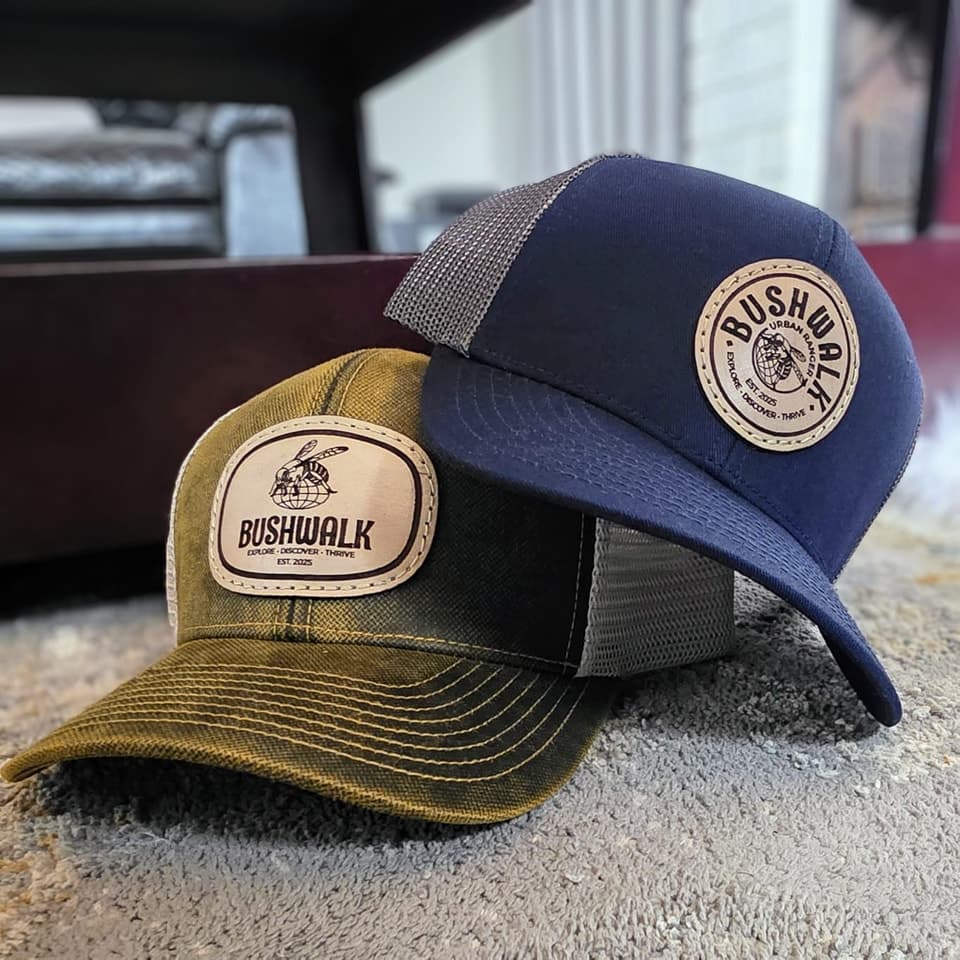 Two trucker caps with round engraved leather patches