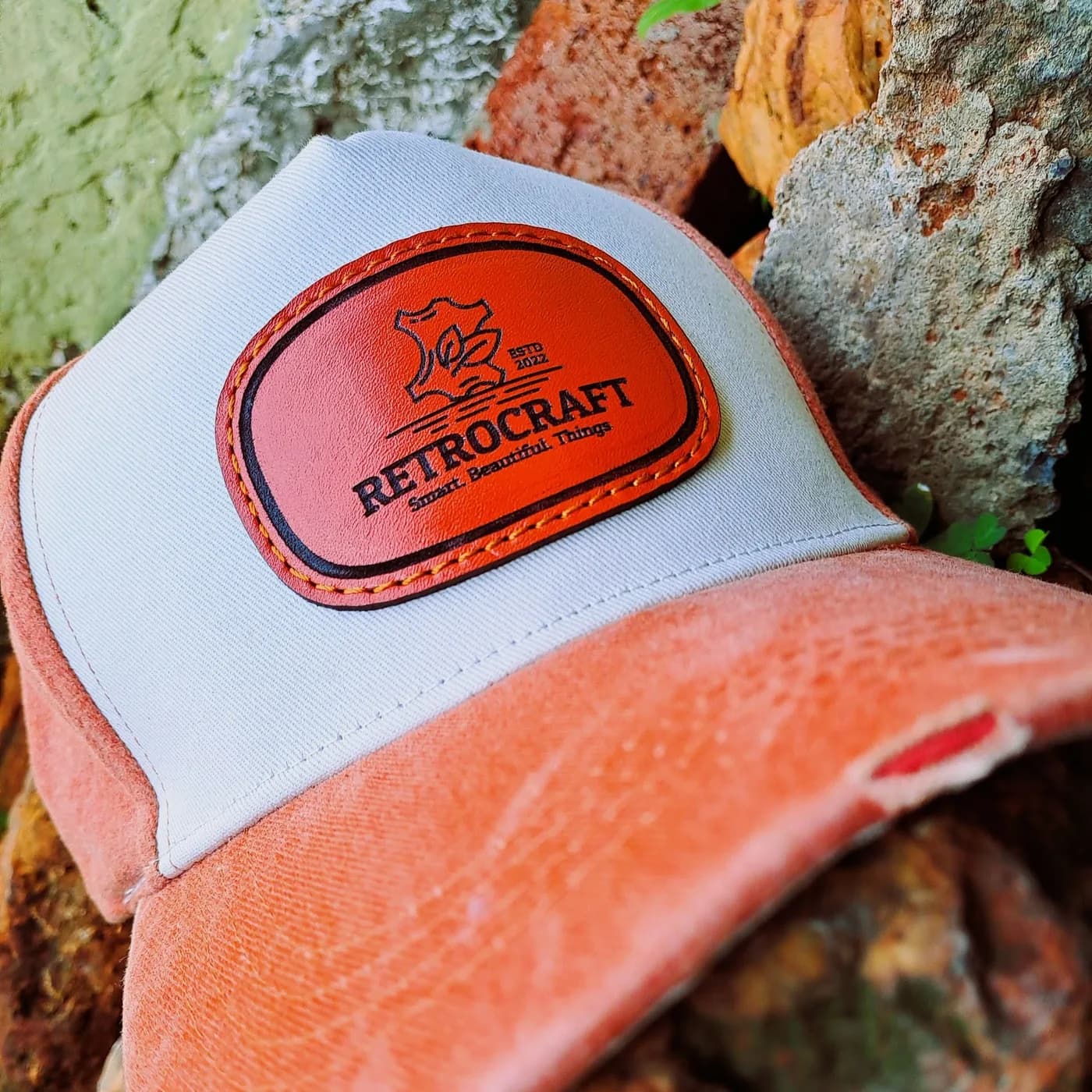 A RetroCraft leather patch trucker cap